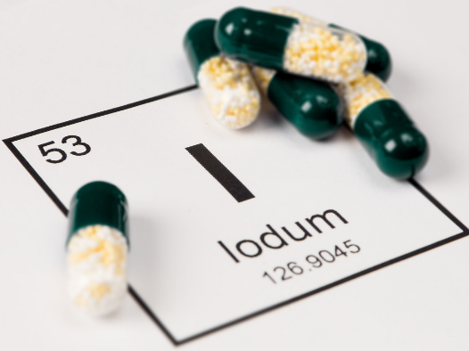 loose iodine pills on top of the Iodine on periodic table